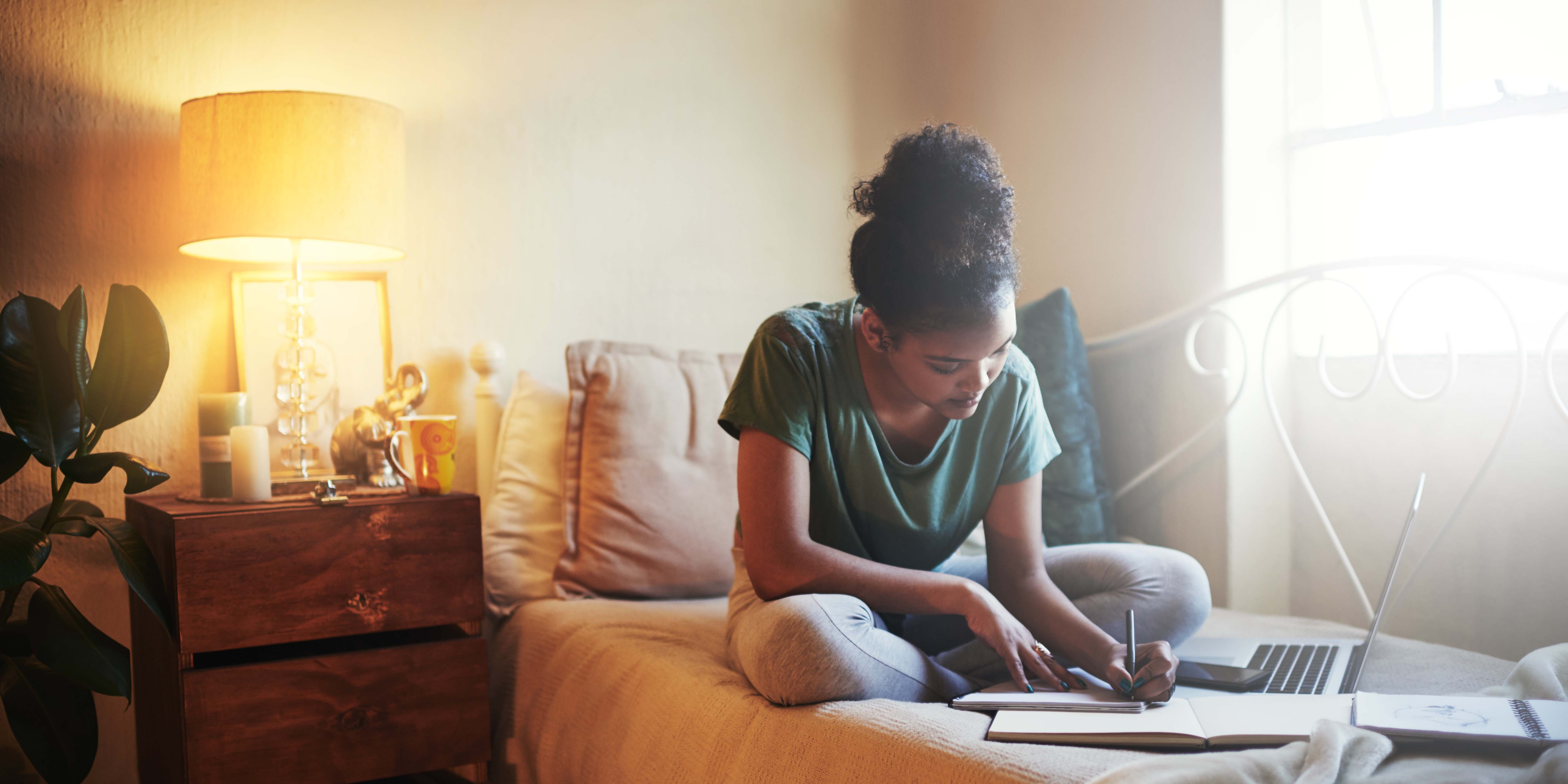 Girl writing in notebook